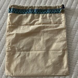 Tory Burch  Beige Drawstring Bag with Blue Patterned Trim